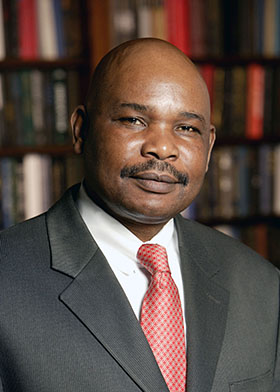 Makau Mutua with books